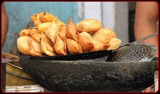 Bunch of Samosa being fried