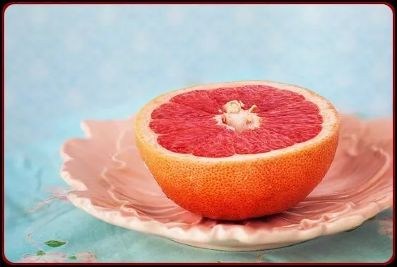 Sliced in half grapefruit in a plate